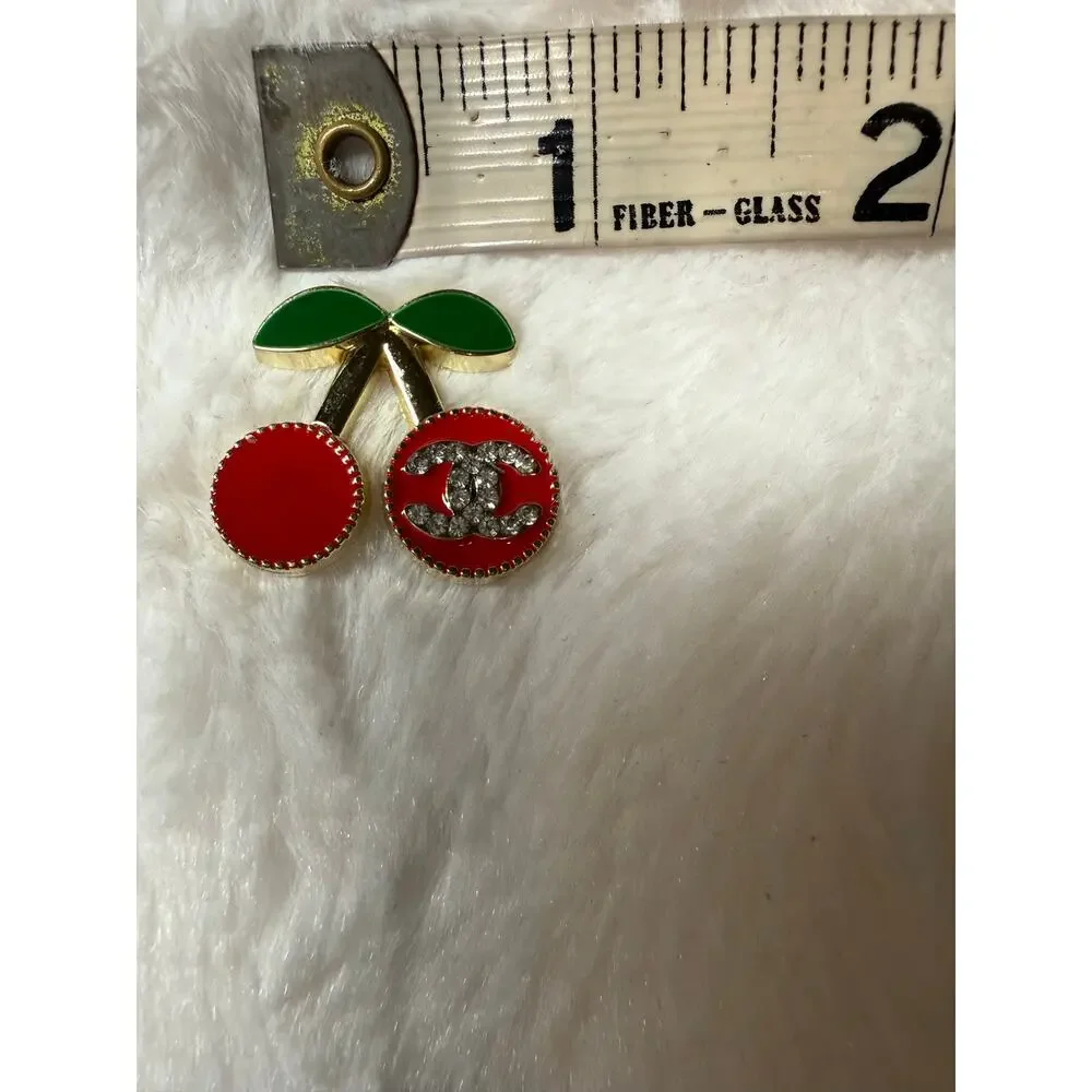 Designer inspired charm with cherries and double C logo in Rhinestones